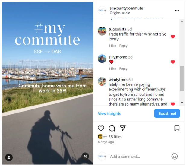 A shadow of a cyclist is cast on a bike path next to a marina filled with boats under a clear blue sky. Text on image reads "#my commute SSF → OAK Commute home with me from work in SSF! Commuter Challenge 2024.